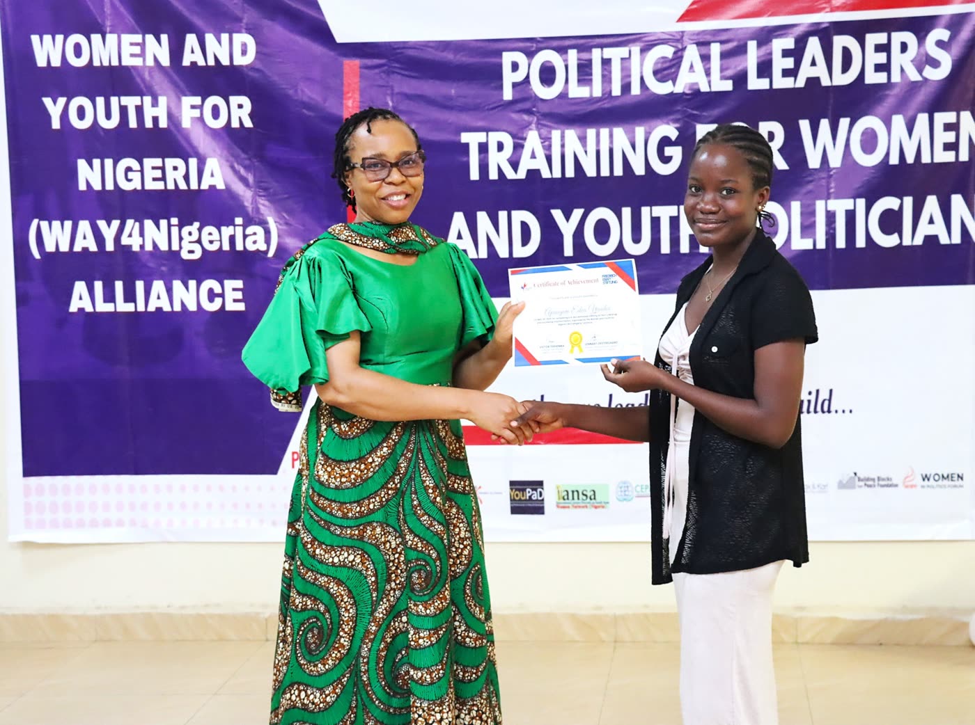 A participant receiving a certificate of achievement