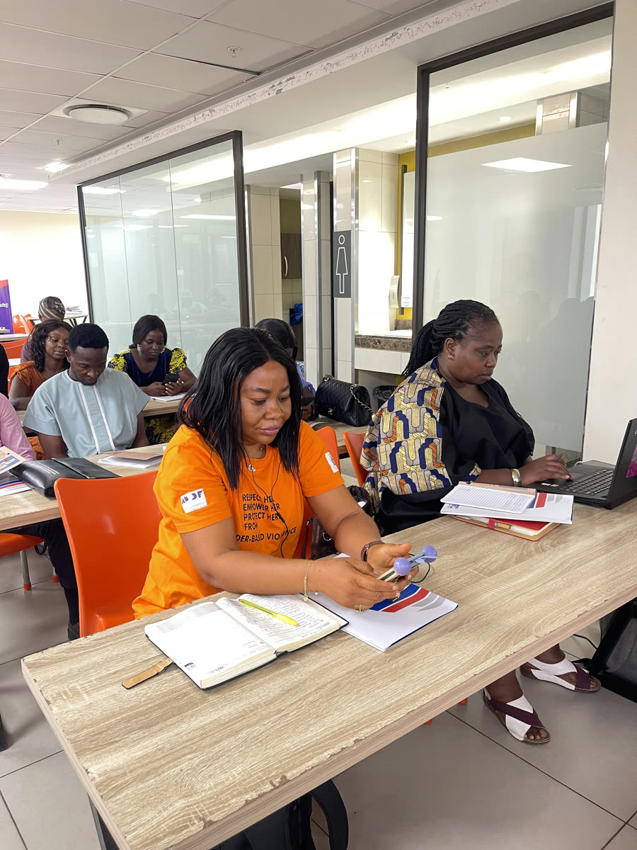 Participants reviewing materials at the registration desk