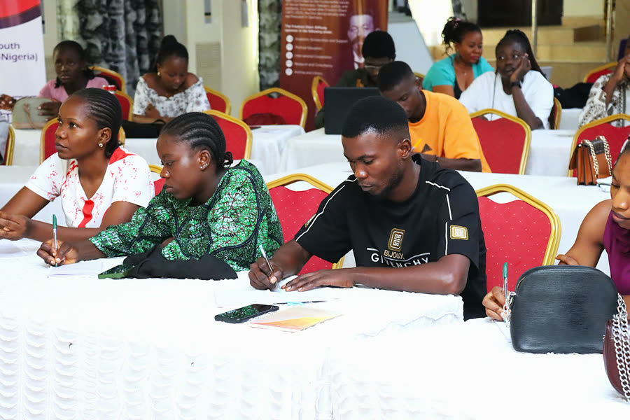Participants taking notes during a training session