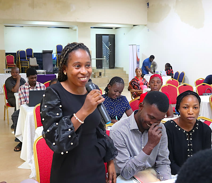 A participant asking a question during an open discussion