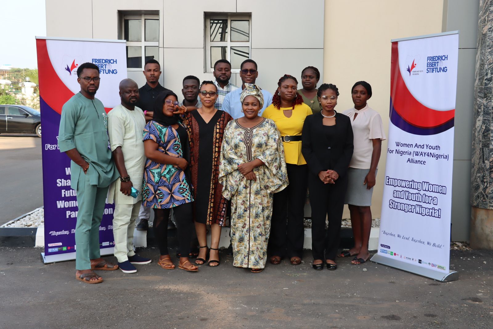 The WAY4Nigeria alliance team beside Friedrich-Ebert-Stiftung banners
